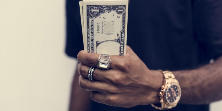 African holding cash