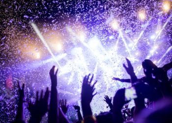 Portrait of happy crowd enjoying at music festival